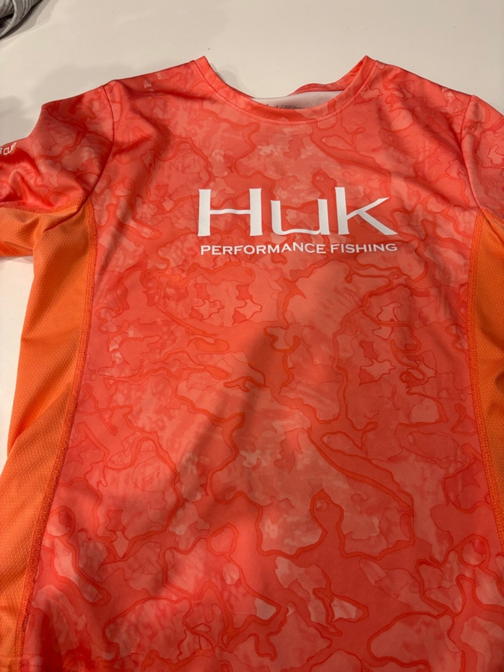 Huk Coral Camo Performance Fishing Shirt with Orange Panels